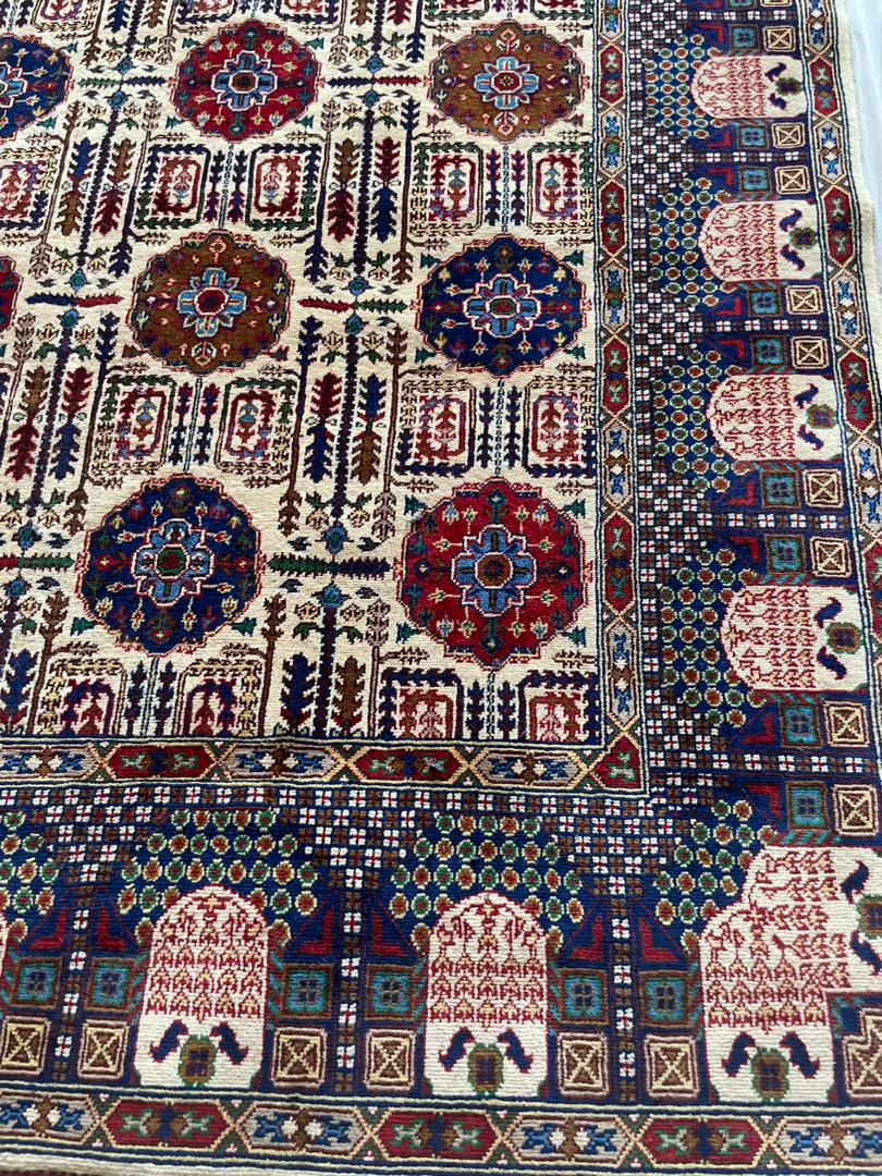 Close-up of a patterned rug with intricate designs.