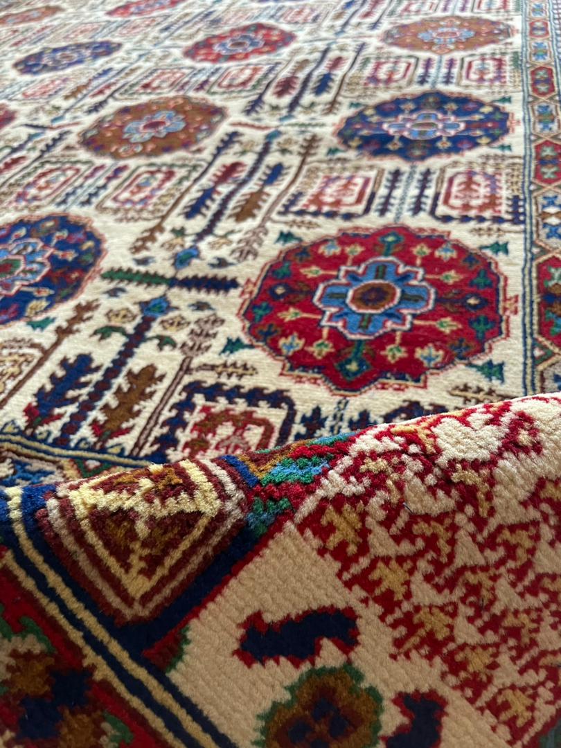 Close-up of a colorful patterned rug with intricate designs.