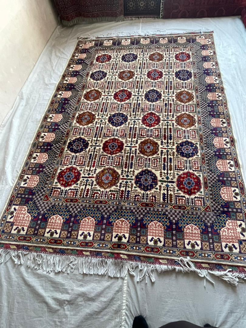 Decorative rug with intricate patterns on a white surface
