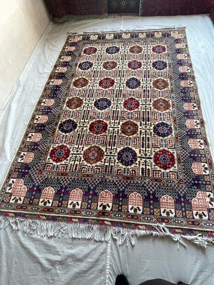 Decorative rug with intricate patterns on a white surface