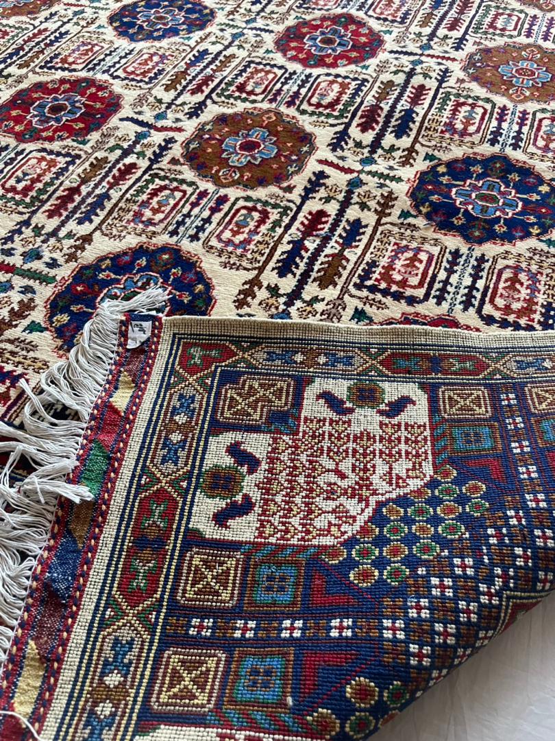 Close-up of a colorful patterned rug with intricate designs.
